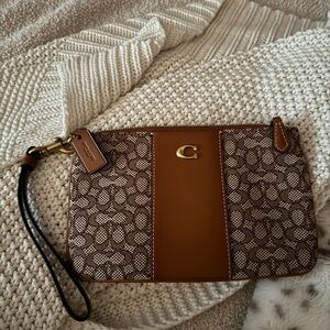 Coach wristlet textile jacquard signature